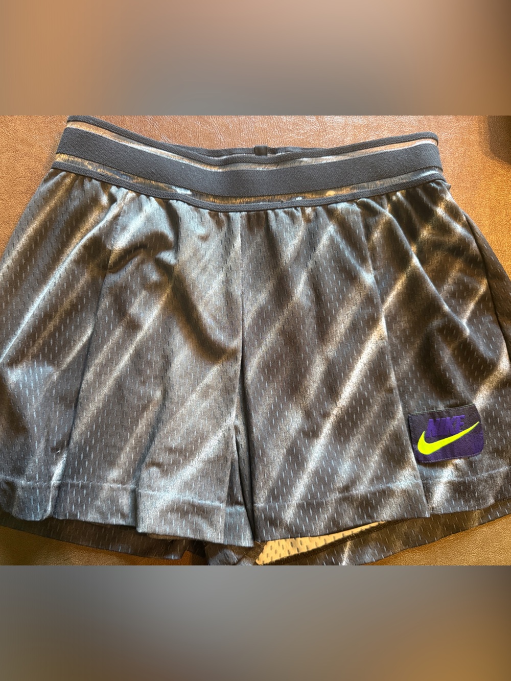 Nike Women’s Black Athletic Shorts with Purple Patch and Neon Green Swoosh